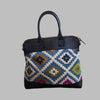 Weekend Kilim Genuine Leather Bag is Handcrafted in Old Cairo, Egypt, This bag is one of a kind  masterpiece, made from vintage fabrics and genuine leather to embody the essence of sustainable luxury.a gift to the world of Ancient craftsmanship meeting modern functionality. A statement of creativity, cultural awareness and limitless style.