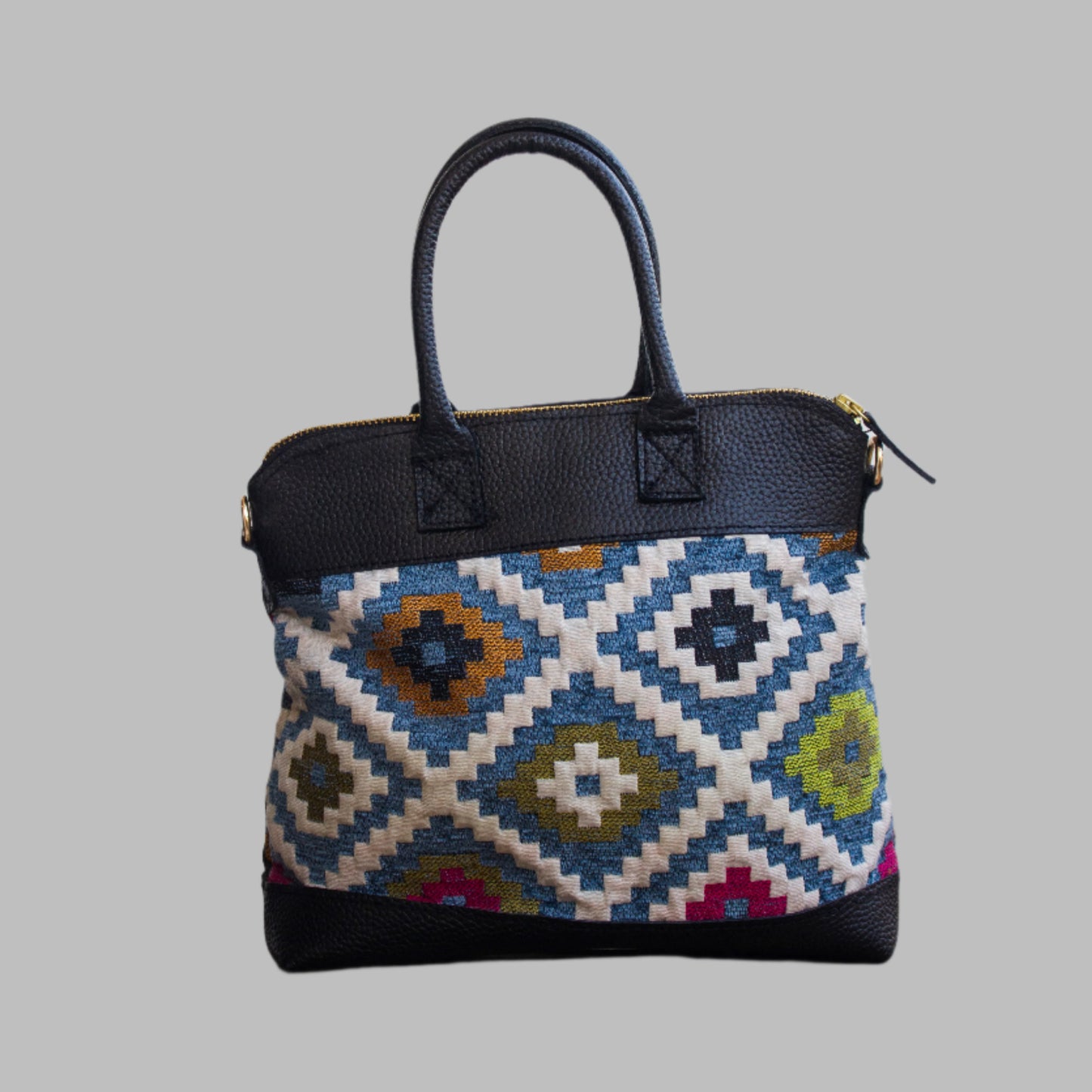 Weekend Kilim Genuine Leather Bag is Handcrafted in Old Cairo, Egypt, This bag is one of a kind  masterpiece, made from vintage fabrics and genuine leather to embody the essence of sustainable luxury.a gift to the world of Ancient craftsmanship meeting modern functionality. A statement of creativity, cultural awareness and limitless style.