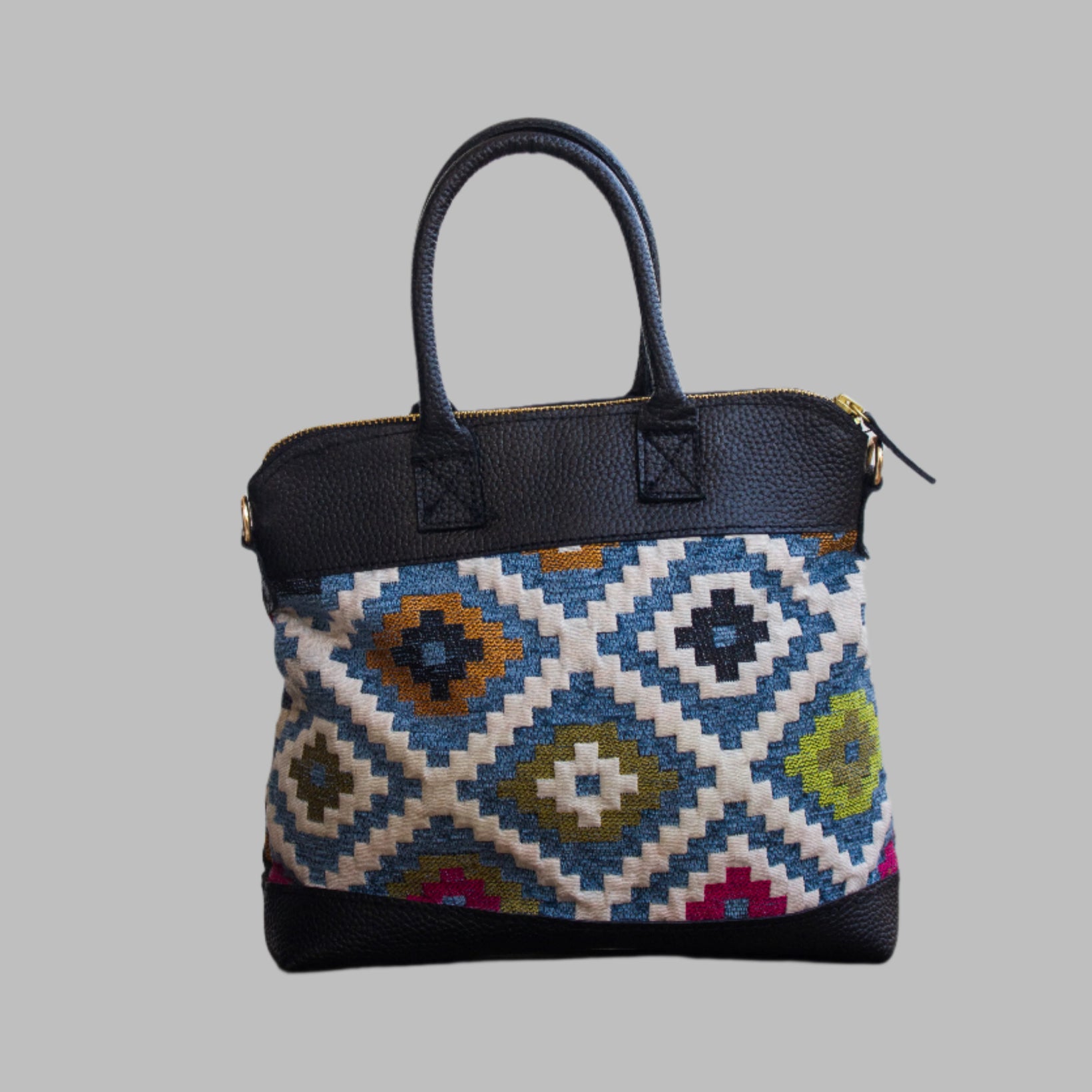 Weekend Kilim Genuine Leather Bag is Handcrafted in Old Cairo, Egypt, This bag is one of a kind  masterpiece, made from vintage fabrics and genuine leather to embody the essence of sustainable luxury.a gift to the world of Ancient craftsmanship meeting modern functionality. A statement of creativity, cultural awareness and limitless style.