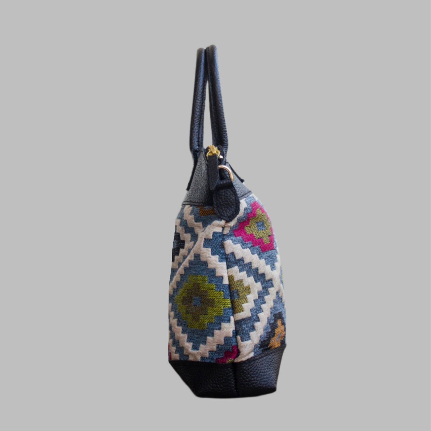 Weekend Kilim Genuine Leather Bag is Handcrafted in Old Cairo, Egypt, This bag is one of a kind  masterpiece, made from vintage fabrics and genuine leather to embody the essence of sustainable luxury.a gift to the world of Ancient craftsmanship meeting modern functionality. A statement of creativity, cultural awareness and limitless style.