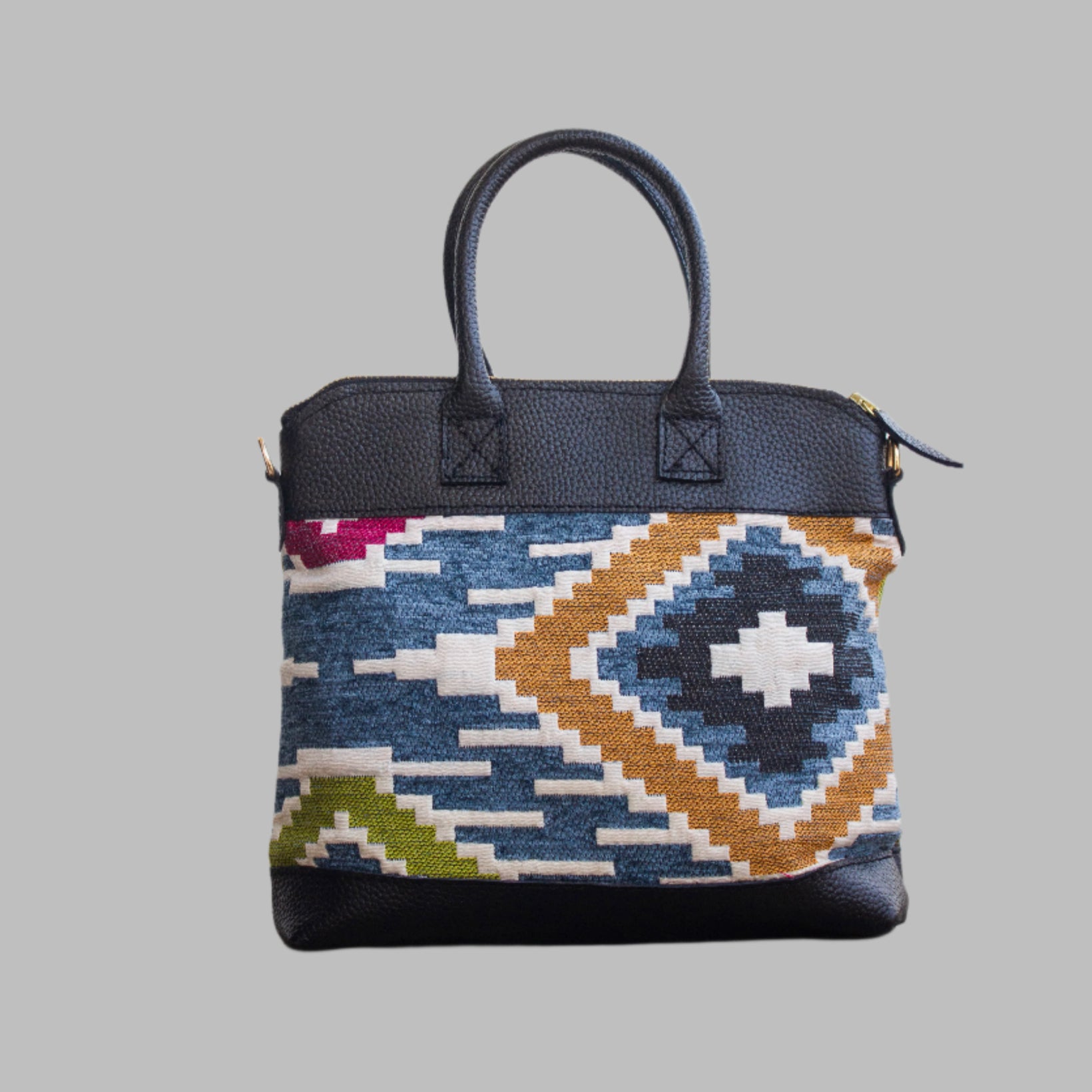 Weekend Kilim Genuine Leather Bag is Handcrafted in Old Cairo, Egypt, This bag is one of a kind  masterpiece, made from vintage fabrics and genuine leather to embody the essence of sustainable luxury.a gift to the world of Ancient craftsmanship meeting modern functionality. A statement of creativity, cultural awareness and limitless style.