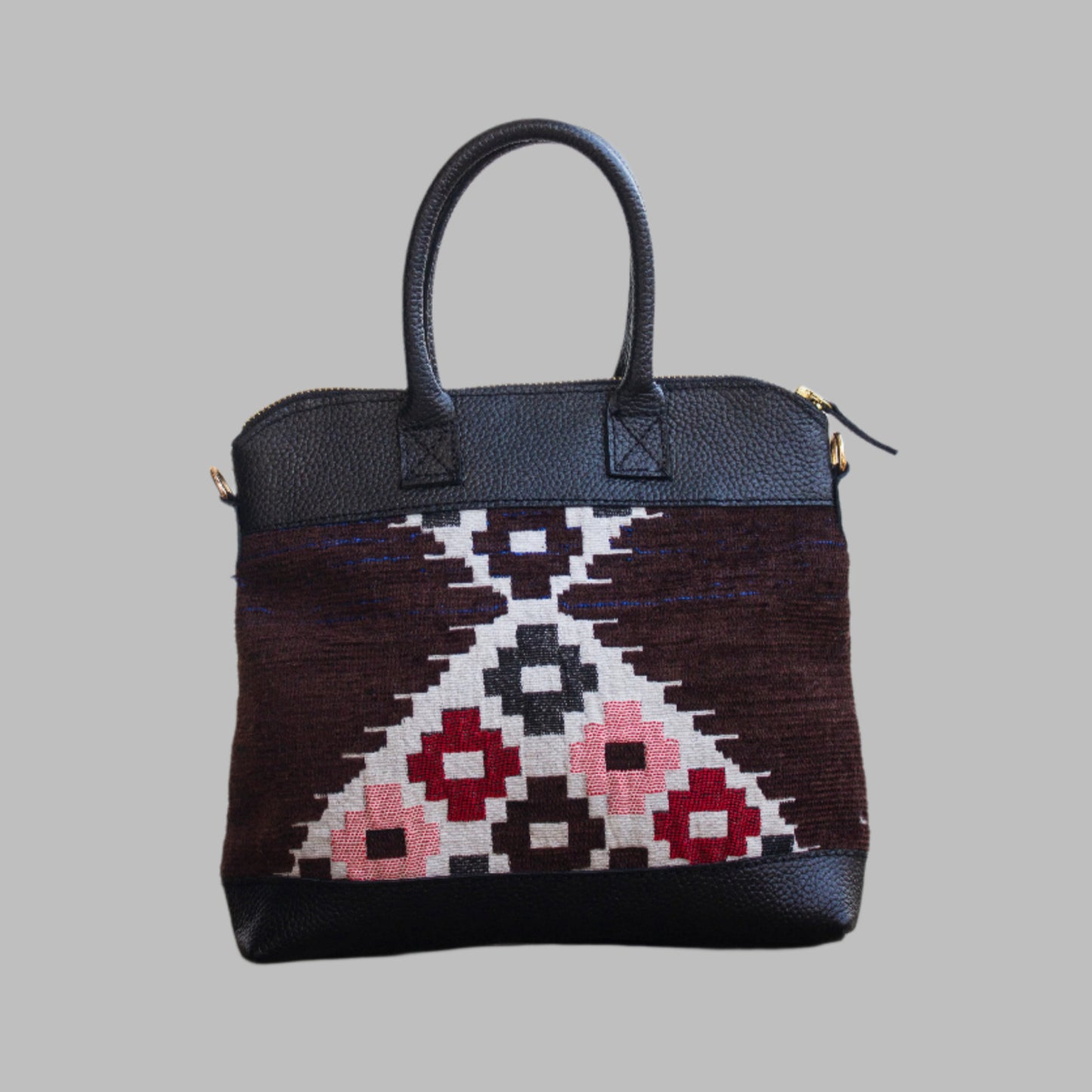 Weekend Kilim Genuine Leather Bag is Handcrafted in Old Cairo, Egypt, This bag is one of a kind  masterpiece, made from vintage fabrics and genuine leather to embody the essence of sustainable luxury.a gift to the world of Ancient craftsmanship meeting modern functionality. A statement of creativity, cultural awareness and limitless style.