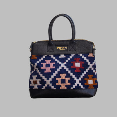 is one of a kind  masterpiece, made from vintage fabrics and genuine leather to embody the essence of sustainable luxury.a gift to the world of Ancient craftsmanship meeting modern functionality. A statement of creativity, cultural awareness and limitless style.