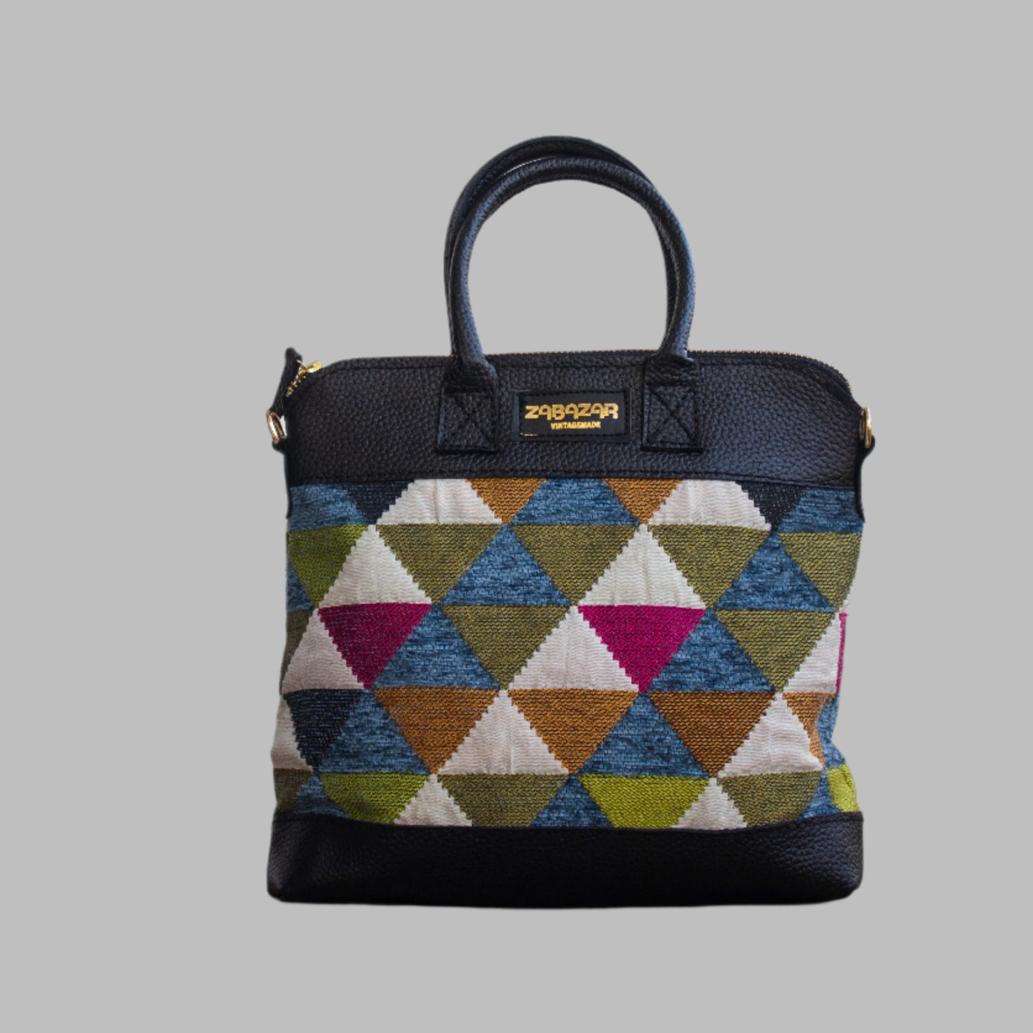Weekend Kilim Genuine Leather Bag is Handcrafted in Old Cairo, Egypt, This bag is one of a kind  masterpiece, made from vintage fabrics and genuine leather to embody the essence of sustainable luxury.a gift to the world of Ancient craftsmanship meeting modern functionality. A statement of creativity, cultural awareness and limitless style.