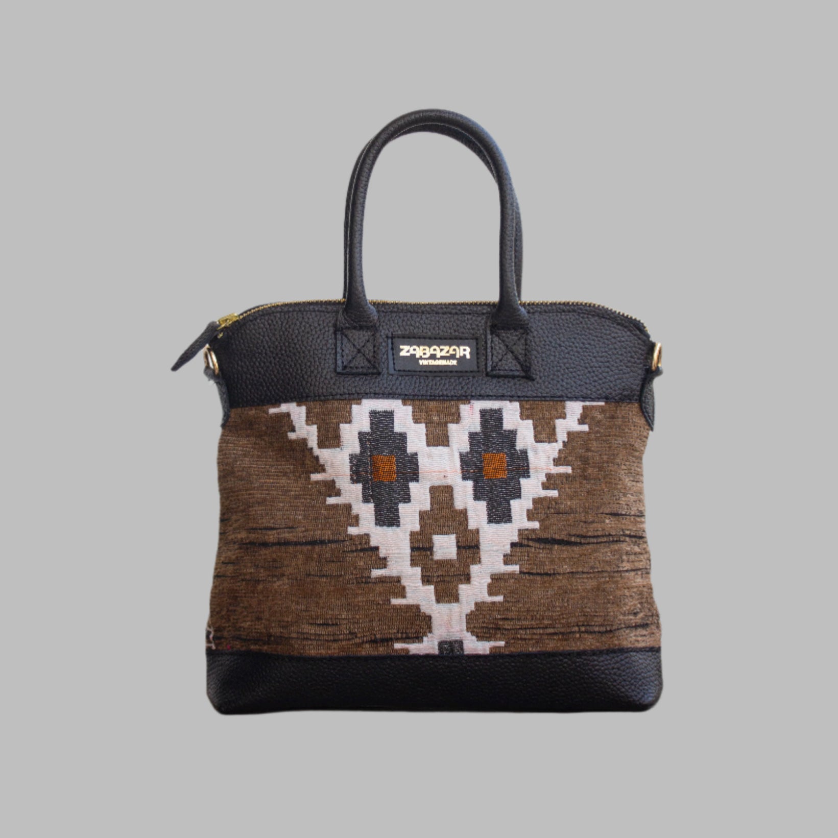 Weekend Kilim Genuine Leather Bag is Handcrafted in Old Cairo, Egypt, This bag is one of a kind  masterpiece, made from vintage fabrics and genuine leather to embody the essence of sustainable luxury.a gift to the world of Ancient craftsmanship meeting modern functionality. A statement of creativity, cultural awareness and limitless style.