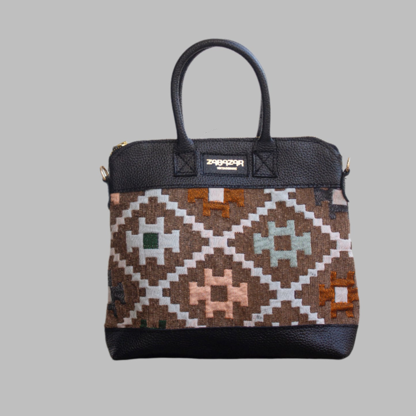 Weekend Kilim Genuine Leather Bag is Handcrafted in Old Cairo, Egypt, This bag is one of a kind  masterpiece, made from vintage fabrics and genuine leather to embody the essence of sustainable luxury.a gift to the world of Ancient craftsmanship meeting modern functionality. A statement of creativity, cultural awareness and limitless style.