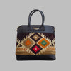 Weekend Kilim Genuine Leather Bag is Handcrafted in Old Cairo, Egypt, This bag is one of a kind  masterpiece, made from vintage fabrics and genuine leather to embody the essence of sustainable luxury.a gift to the world of Ancient craftsmanship meeting modern functionality. A statement of creativity, cultural awareness and limitless style.