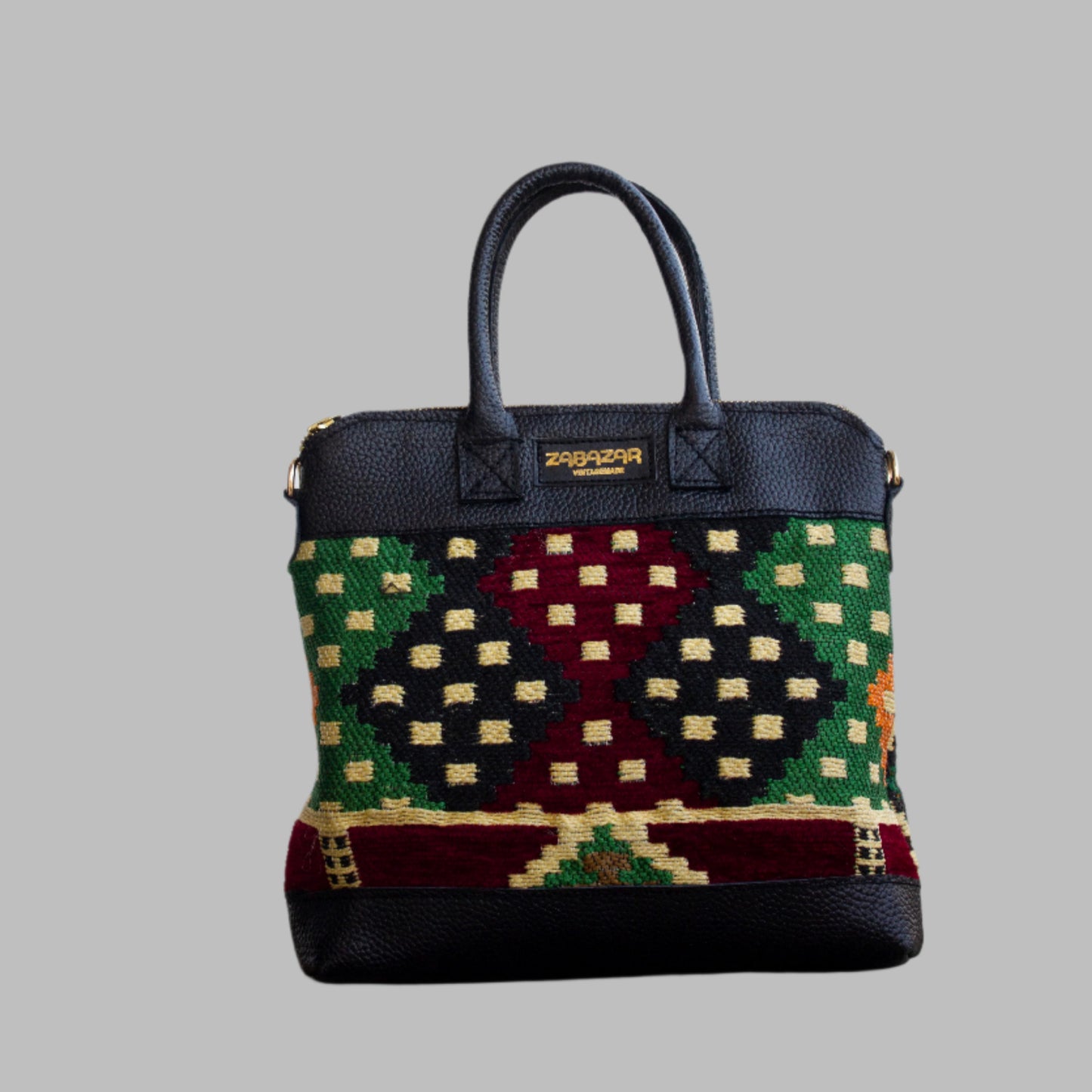 Weekend Kilim Genuine Leather Bag is Handcrafted in Old Cairo, Egypt, This bag is one of a kind  masterpiece, made from vintage fabrics and genuine leather to embody the essence of sustainable luxury.a gift to the world of Ancient craftsmanship meeting modern functionality. A statement of creativity, cultural awareness and limitless style.