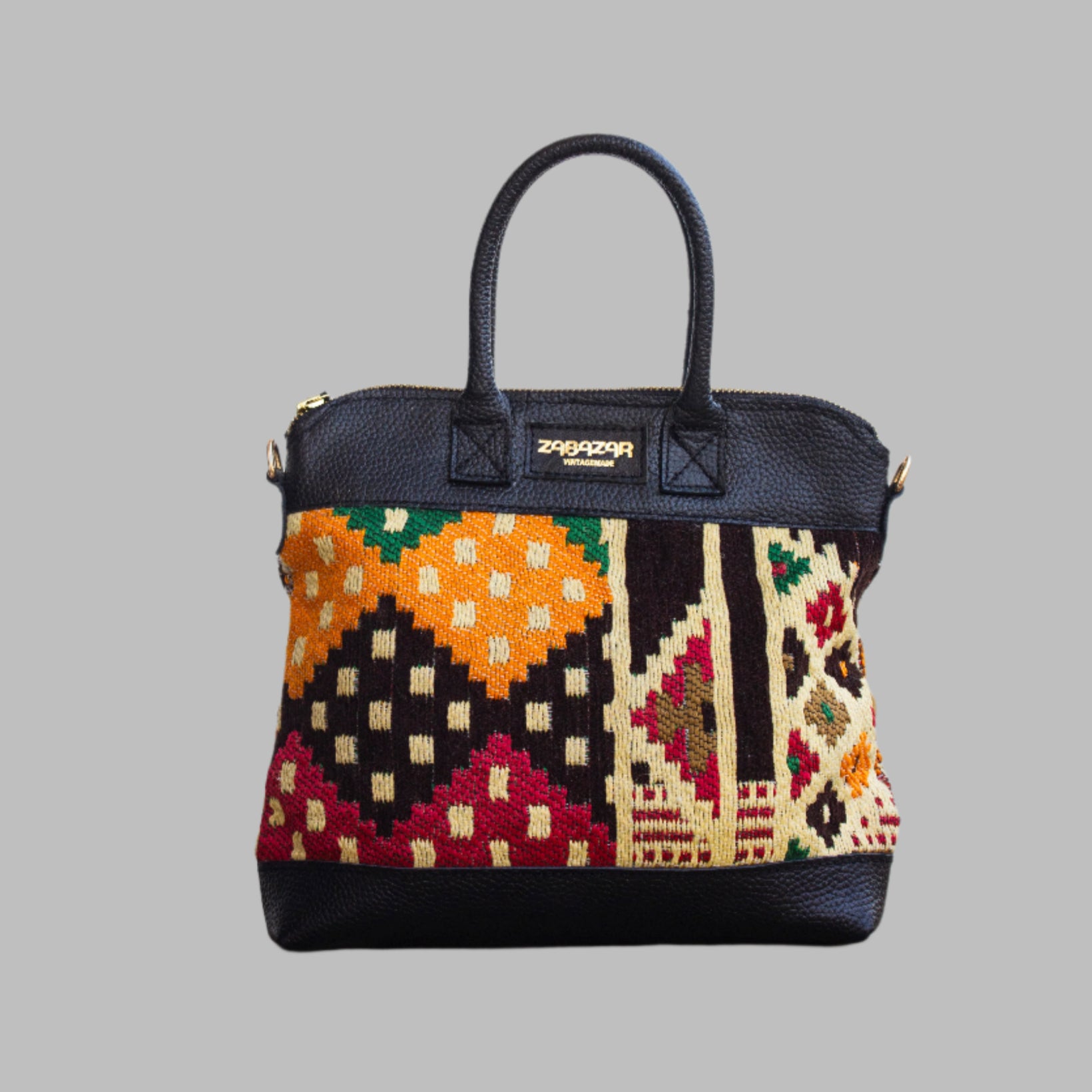 Weekend Kilim Genuine Leather Bag is Handcrafted in Old Cairo, Egypt, This bag is one of a kind  masterpiece, made from vintage fabrics and genuine leather to embody the essence of sustainable luxury.a gift to the world of Ancient craftsmanship meeting modern functionality. A statement of creativity, cultural awareness and limitless style.