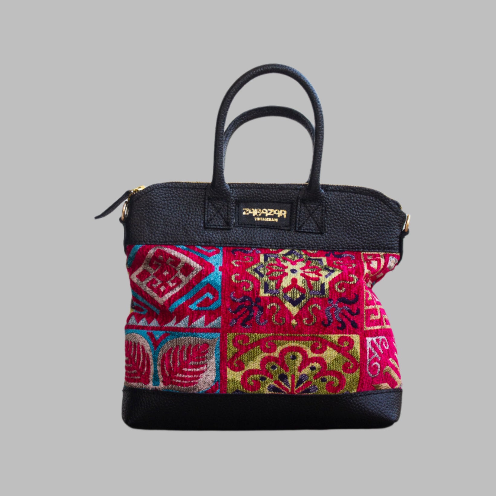 Weekend Kilim Genuine Leather Bag is Handcrafted in Old Cairo, Egypt, This bag is one of a kind  masterpiece, made from vintage fabrics and genuine leather to embody the essence of sustainable luxury.a gift to the world of Ancient craftsmanship meeting modern functionality. A statement of creativity, cultural awareness and limitless style.