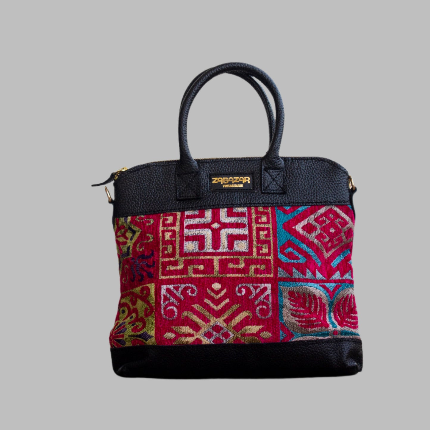 Weekend Kilim Genuine Leather Bag is Handcrafted in Old Cairo, Egypt, This bag is one of a kind  masterpiece, made from vintage fabrics and genuine leather to embody the essence of sustainable luxury.a gift to the world of Ancient craftsmanship meeting modern functionality. A statement of creativity, cultural awareness and limitless style.