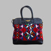 Weekend Kilim Genuine Leather Bag is Handcrafted in Old Cairo, Egypt, This bag is one of a kind  masterpiece, made from vintage fabrics and genuine leather to embody the essence of sustainable luxury.a gift to the world of Ancient craftsmanship meeting modern functionality. A statement of creativity, cultural awareness and limitless style.