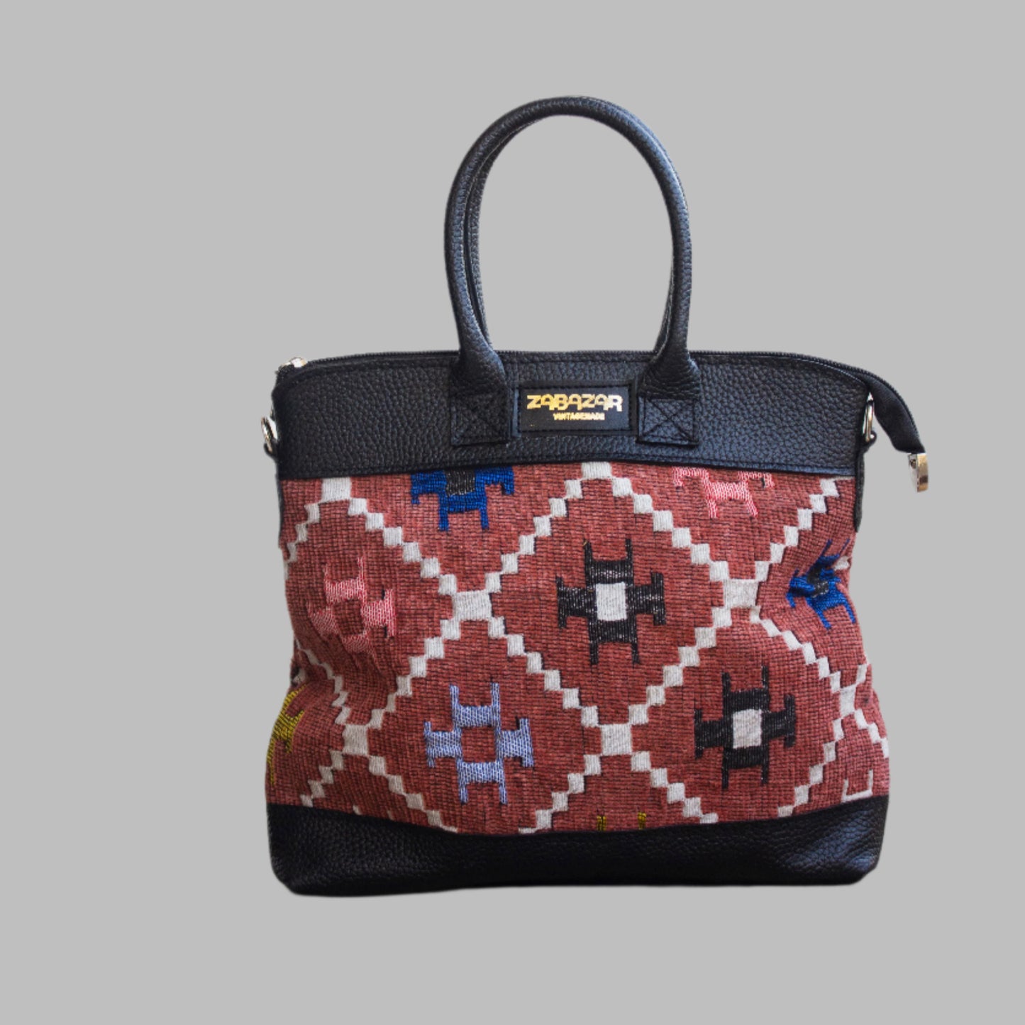 Weekend Kilim Genuine Leather Bag is Handcrafted in Old Cairo, Egypt, This bag is one of a kind  masterpiece, made from vintage fabrics and genuine leather to embody the essence of sustainable luxury.a gift to the world of Ancient craftsmanship meeting modern functionality. A statement of creativity, cultural awareness and limitless style.