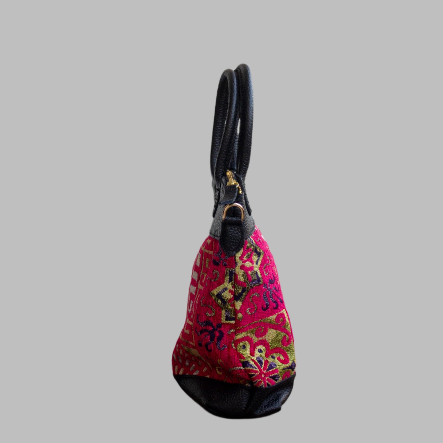 Weekend Kilim Genuine Leather Bag is Handcrafted in Old Cairo, Egypt, This bag is one of a kind  masterpiece, made from vintage fabrics and genuine leather to embody the essence of sustainable luxury.a gift to the world of Ancient craftsmanship meeting modern functionality. A statement of creativity, cultural awareness and limitless style.