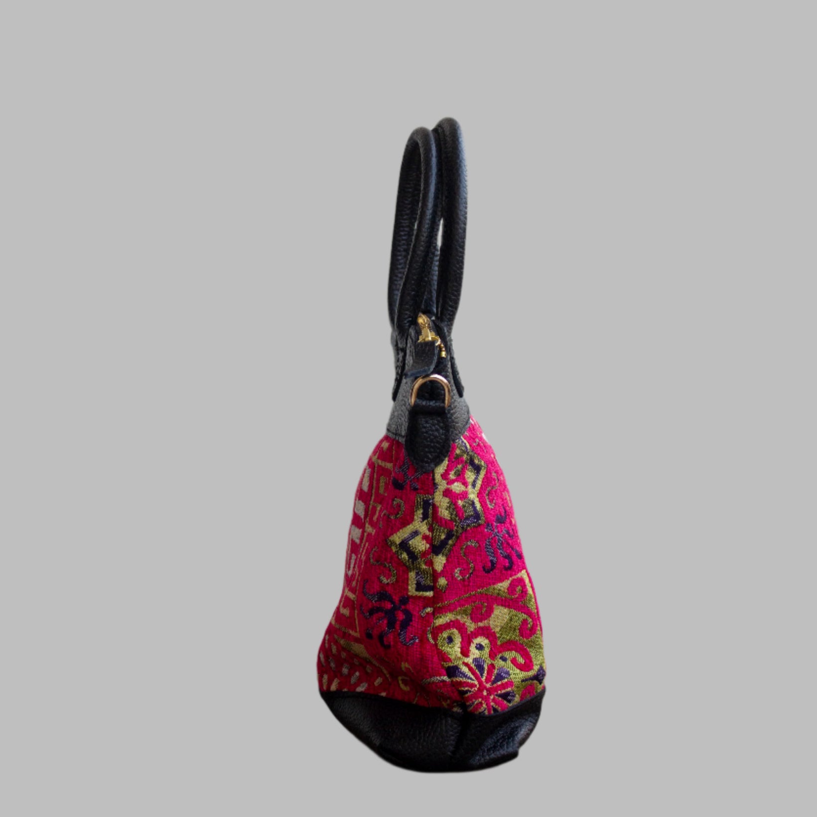 Weekend Kilim Genuine Leather Bag is Handcrafted in Old Cairo, Egypt, This bag is one of a kind  masterpiece, made from vintage fabrics and genuine leather to embody the essence of sustainable luxury.a gift to the world of Ancient craftsmanship meeting modern functionality. A statement of creativity, cultural awareness and limitless style.