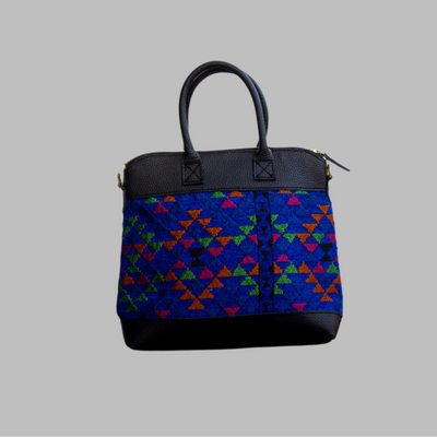 Weekend Kilim Genuine Leather Bag is Handcrafted in Old Cairo, Egypt, This bag is one of a kind  masterpiece, made from vintage fabrics and genuine leather to embody the essence of sustainable luxury.a gift to the world of Ancient craftsmanship meeting modern functionality. A statement of creativity, cultural awareness and limitless style.